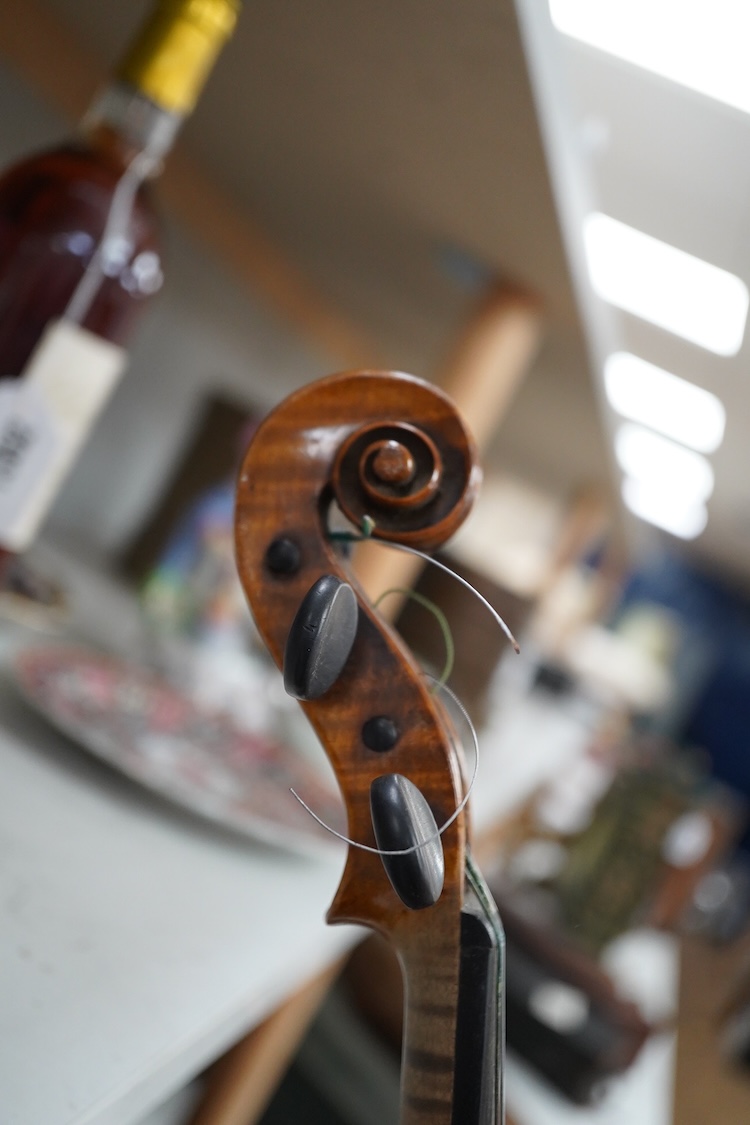 A late 19th century German violin in a Hill & Son oak case, with Hill canvas slip cover, together with an unbranded silver mounted bow, and another, ivory submission ref: 9HJU3B45 and ZC2E1GCP